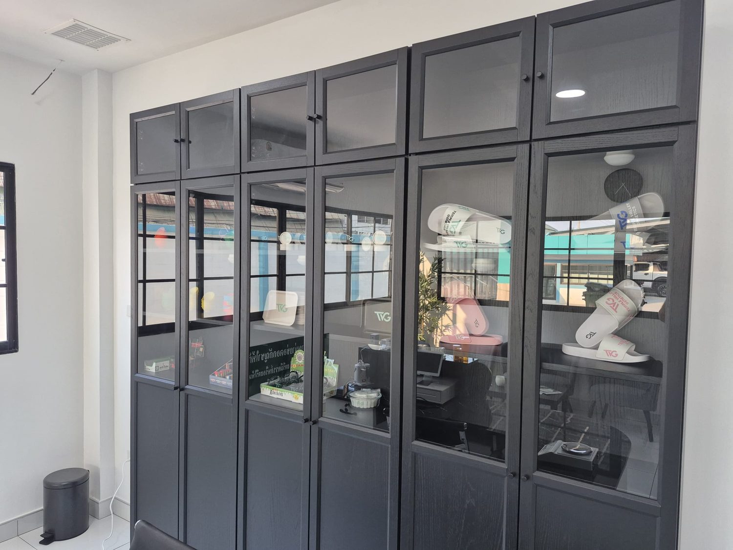 TVG display cabinet with branded merchandise